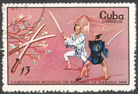 MOSCOW, RUSSIA - CIRCA FEBRUARY, 2016: a post stamp printed in CUBA shows samurai fencing, the series "World Fencing Championships, Havana", circa 1969のeditorial素材