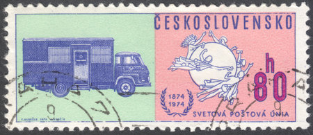 MOSCOW, RUSSIA - CIRCA JANUARY, 2016: a post stamp printed in CZECHOSLOVAKIA shows Postal Union Emblem & Early mail truck, the series "The 100th Anniversary of the Universal Postal Union", circa 1974のeditorial素材