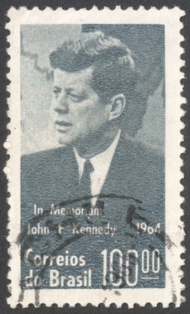 MOSCOW, RUSSIA - JANUARY, 2016: a post stamp printed in BRAZIL shows a portrait of  John F. Kennedy, devoted to President Kennedy Commemoration, circa 1964のeditorial素材