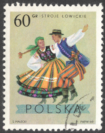 MOSCOW, RUSSIA - CIRCA JANUARY, 2016: a post stamp printed in POLAND shows traditional Polish dancing, the series "Folk Costumes", circa 1969のeditorial素材