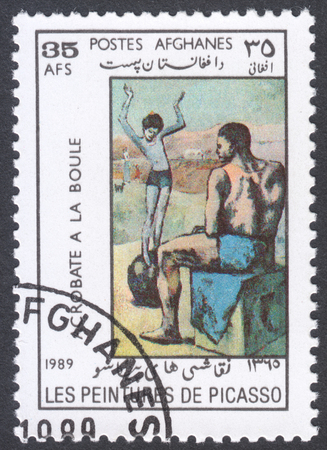 MOSCOW, RUSSIA - CIRCA FEBRUARY, 2016: a post stamp printed in AFGHANISTAN shows painting "Girl on the Ball" by Picasso, the series "Paintings by Pablo Picasso", circa 1989のeditorial素材