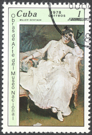 MOSCOW, RUSSIA - CIRCA FEBRUARY, 2016: a post stamp printed in CUBA shows a painting "The seated woman" by R.Madrazo, the series "The National Museum Paintings", circa 1978のeditorial素材