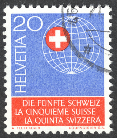 MOSCOW, RUSSIA - CIRCA APRIL, 2016: a post stamp printed in SWITZERLAND shows Globe with Swiss cross, dedicated to the 5th Switzerland Yearのeditorial素材