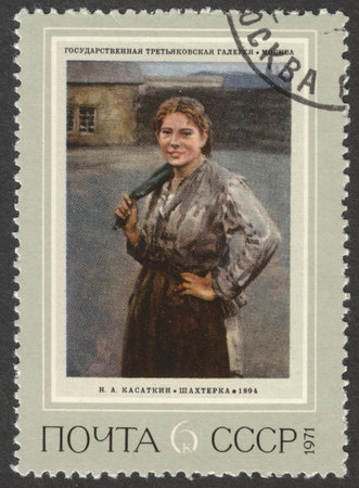 MOSCOW, RUSSIA - CIRCA APRIL, 2016: a post stamp printed in the USSR shows a painting "Woman Miner" by N. A. Kasatkin, the series "Russian Paintings", circa 1971のeditorial素材
