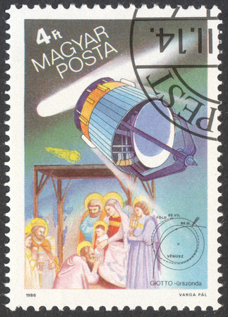 MOSCOW, RUSSIA - CIRCA MAY, 2016: a post stamp printed in HUNGARY shows a space ship and a comet, the series "Halley`s Comet", circa 1986のeditorial素材