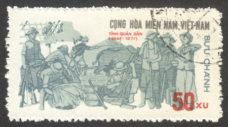 MOSCOW, RUSSIA - CIRCA JULY, 2016: a stamp printed in VIETCONG shows Fighters and Workers, the series "The 10th Anniversary of the PLAF", circa 1971のeditorial素材