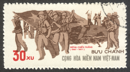 MOSCOW, RUSSIA - CIRCA JULY, 2016: a stamp printed in VIETCONG shows Guerilla Force, the series "The 10th Anniversary of the PLAF", circa 1971のeditorial素材