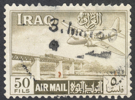 MOSCOW, RUSSIA - CIRCA AUGUST, 2016: a stamp printed in IRAQ shows an aeroplane, circa 1950sのeditorial素材
