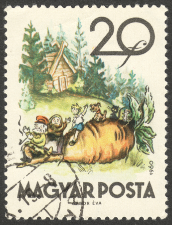 MOSCOW, RUSSIA - CIRCA SEPTEMBER, 2016: a stamp printed in HUNGARY shows an illustration of the Russian folk fairy tale "The Turnip", the series "Fairy Tales", circa 1960のeditorial素材