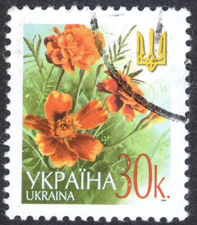MOSCOW, RUSSIA - CIRCA OCTOBER, 2016: a post stamp printed in UKRAINE shows flowers and a trident, the Definitive Issue, circa 2003のeditorial素材