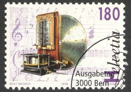 MOSCOW, RUSSIA - CIRCA OCTOBER, 2016: a post stamp printed in SWITZERLAND shows Phonograph of the type Kalliope, the series "Mechanical music", circa 1996のeditorial素材