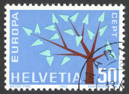 MOSCOW, RUSSIA - CIRCA DECEMBER, 2016: a post stamp printed in SWITZERLAND shows a stylised tree with 19 leaves, the series "Europa (C.E.P.T.)", circa 1962のeditorial素材