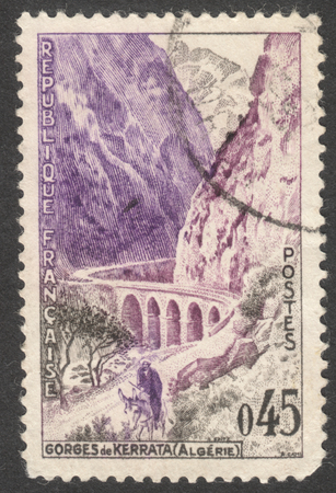 MOSCOW, RUSSIA - CIRCA DECEMBER, 2016: a post stamp printed in FRANCE shows Kerrata Gorges (Algeria), the series "Tourism", circa 1960のeditorial素材