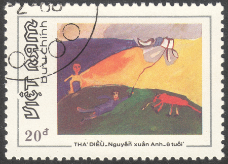 MOSCOW RUSSIA - CIRCA DECEMBER 2017: a post stamp printed in VIETNAM shows "The flying kites" - drawing by Nguyen Xuan Oanh, the series "The Vietnamese childrenâs drawings", circa 1988のeditorial素材