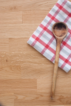 Wooden spoon and towelの写真素材