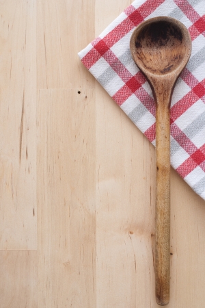 Wooden spoon and towelの写真素材