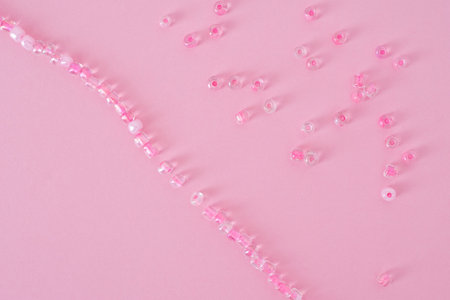 Pink background with pearlsの写真素材