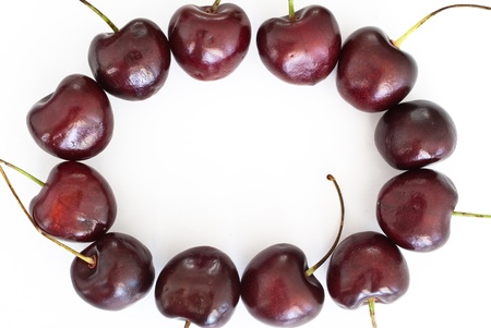 Cherries round frame on white backgroundの写真素材