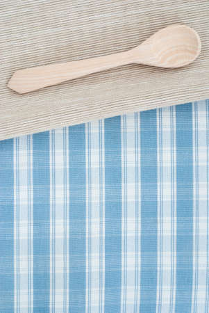 wooden spoon on checkered backgroundの写真素材