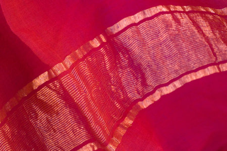 sari textile - red silk with golden stripesの写真素材