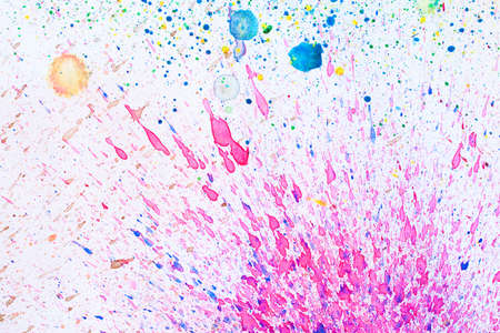 colorful splash - Watercolors on paper backgroundの写真素材