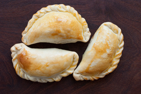 fresh empanada - traditional food  on wooden backgroundの写真素材
