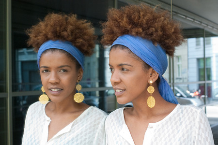 young afro american woman in a mirrorの写真素材