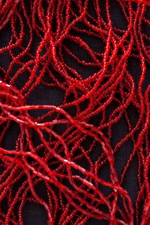 close up of red pearls on black backgroundの写真素材