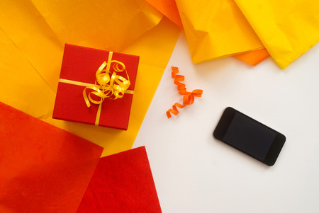 close up of isolated digital Tablet and red christmas gift box - Free text space - studio shotの写真素材