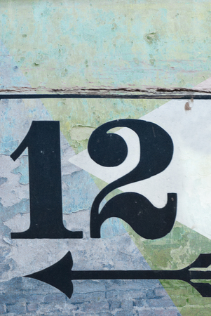 Vintage Number Twelve and arrow on textured backgroundの写真素材