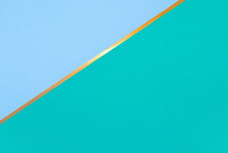 golden line on color paper background - abstract graphic designの写真素材