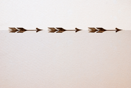 vintage arrow printed on antique  paper textureの写真素材