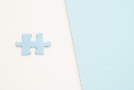 isolated blue Puzzle piece on white paper backgroundの写真素材