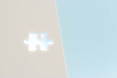 isolated blue Puzzle piece on grey paper backgroundの写真素材