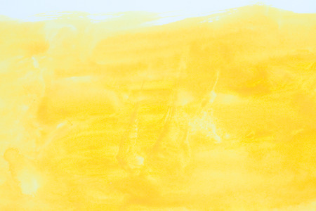 yellow watercolors on paper texture - handpainted design element - abstract backroundの写真素材