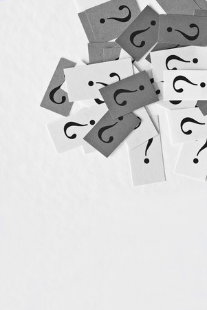 FAQ - Question marks on white paper backgroundの写真素材