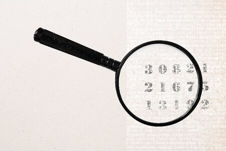 magnifying glass and vintage numbersの写真素材