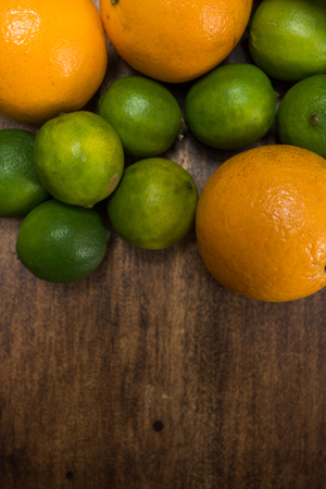 fresh citrus fruits on wooden table - studio shot from aboveの写真素材