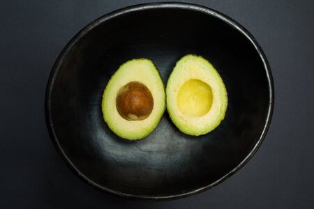 Avocado - tropical fruit in a bowl - studio shot on black background from above
natural greenery, trend color,  color of the year 2017の写真素材