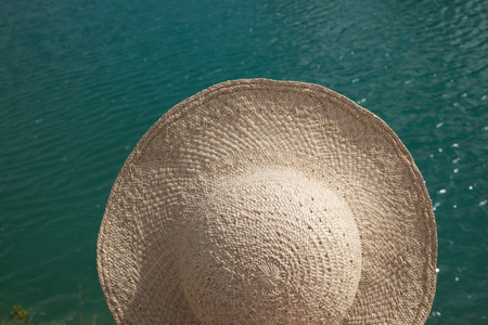 summer hat from above - blue water surface - close up of water textureの写真素材