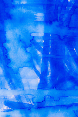 blue watercolor on paper textureの写真素材
