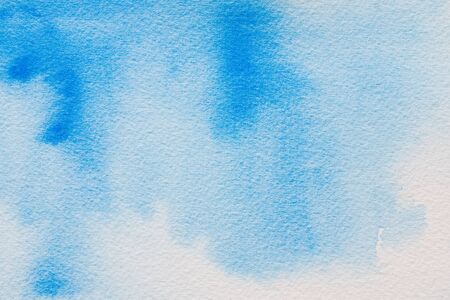 blue watercolor on paper textureの写真素材