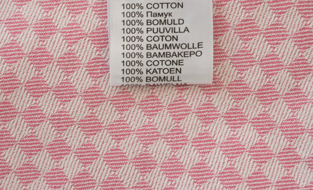 label 100% cotton on textile background
