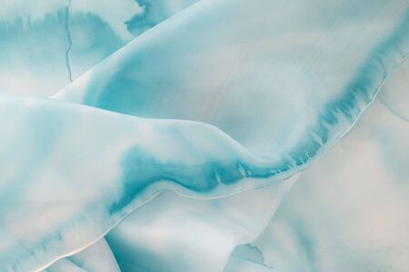 blue silk - close up of a silk scarf - pastel toneの写真素材