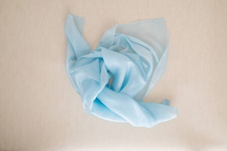 close up of a blue silk scarf - pastel tone - bright blue colorの写真素材