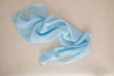 close up of a blue silk scarf - pastel tone - bright blue colorの写真素材