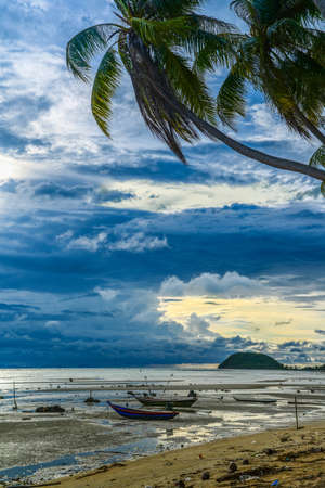 Two boats on sea beach during about to rainの写真素材