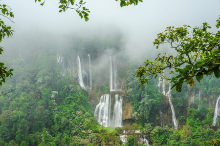 Thi Lo Su waterfall in fog in Tak province, Thailandの写真素材