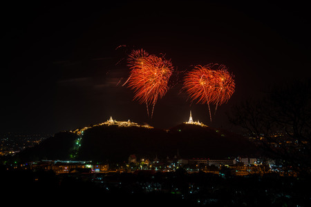 Fireworks at Kao Wang mountain, over the cityscape of Petchburi, Thailandの写真素材