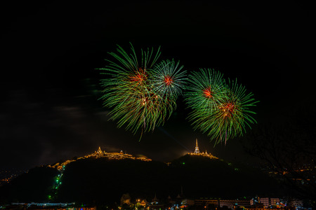 Fireworks at Kao Wang mountain, over the cityscape of Petchburi, Thailandの写真素材